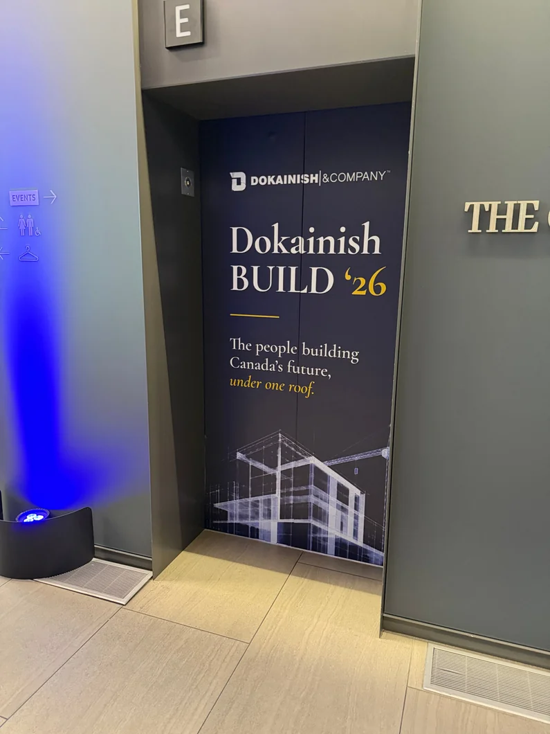 Dokainish event signage installed in a venue
